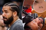 Drake's New Face Tattoo Raises Eyebrows as Fans Wonder About the Meaning ·